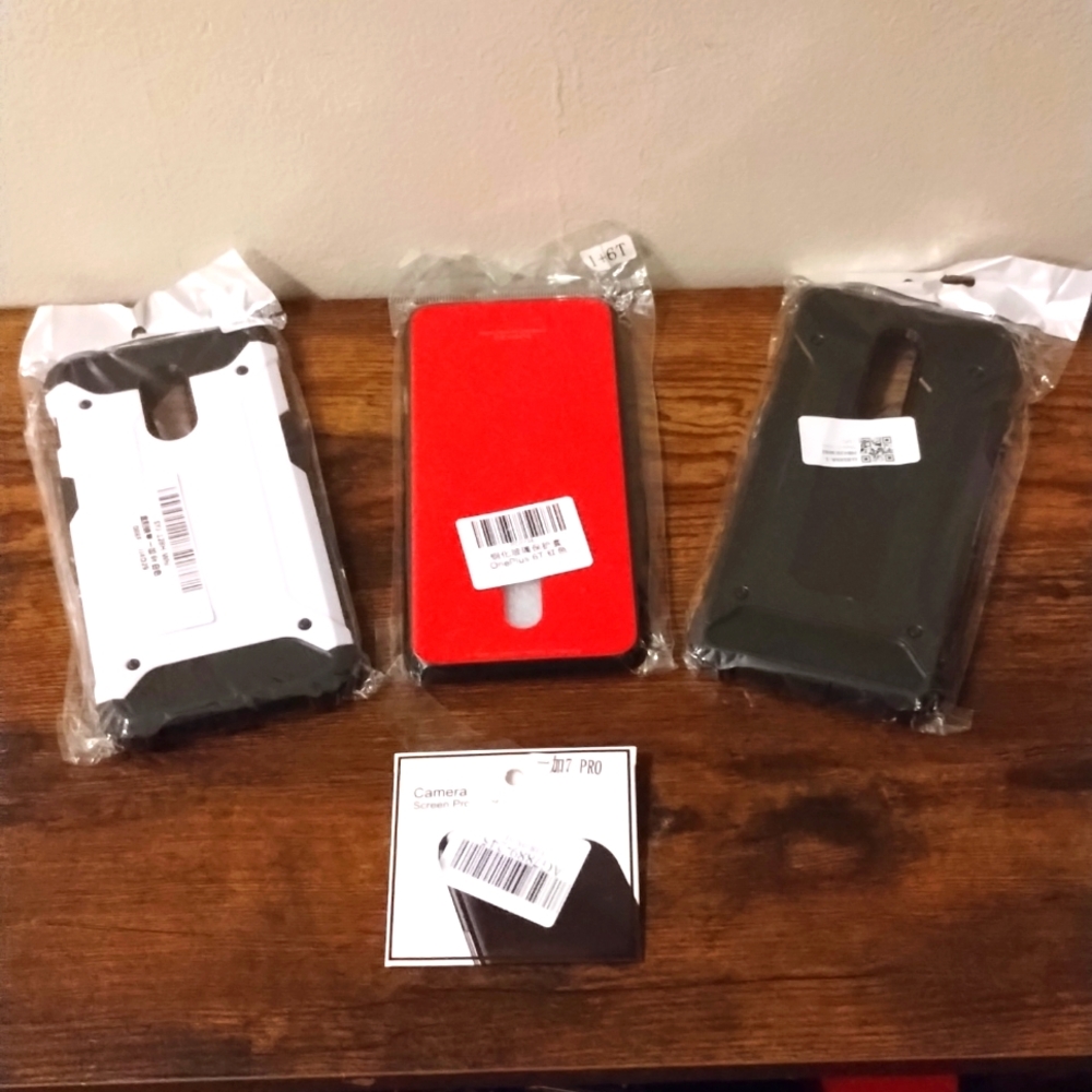 (3) OnePlus cases & 1 lens protector, all 3 together.